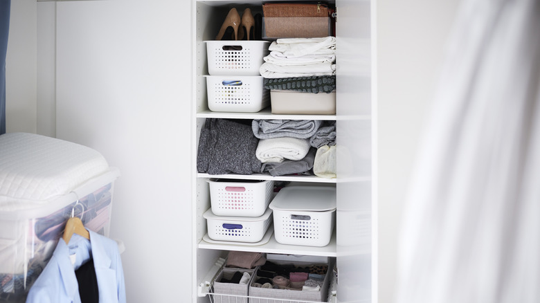 View of baskets in open wardrobe