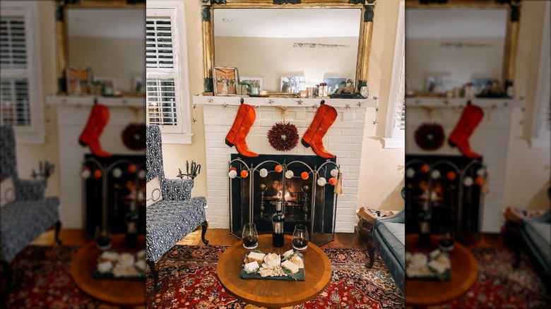 Boots hung as stockings on fireplace