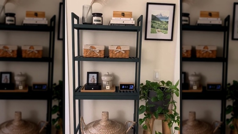 Decorative items displayed on a wooden shelf against a wall