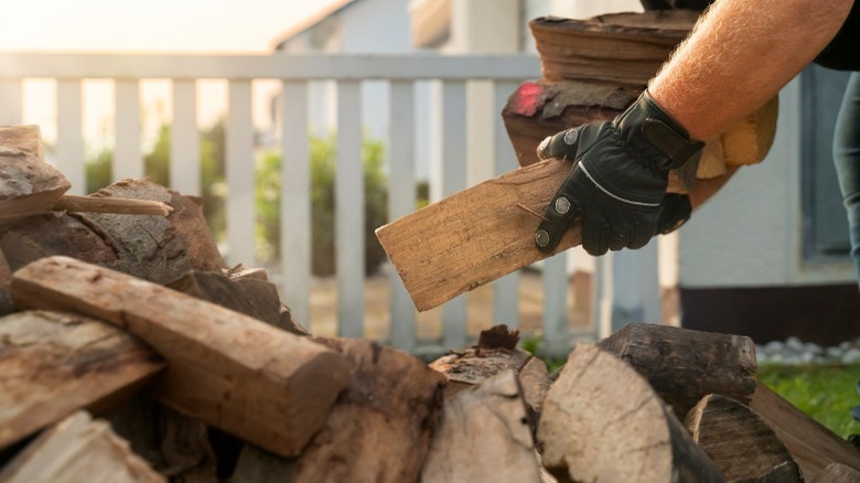 Stacking firewood outside