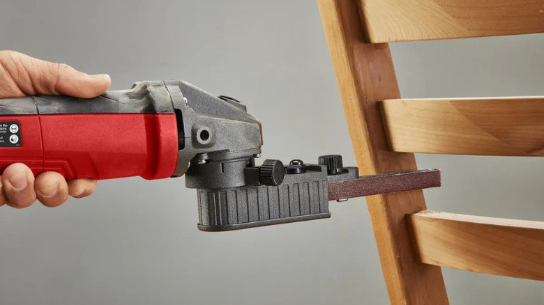 Bauer's 5.3 Amp, ½ in. x 18 in. Bandfile Belt Sander being used to sand a chair