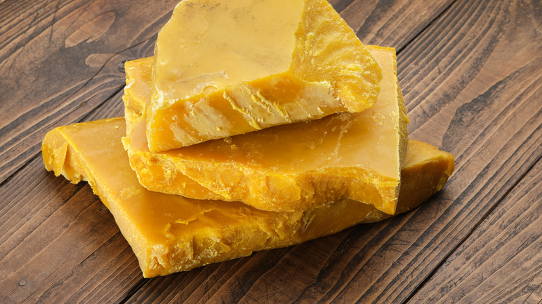 Chunks of natural beeswax on a table