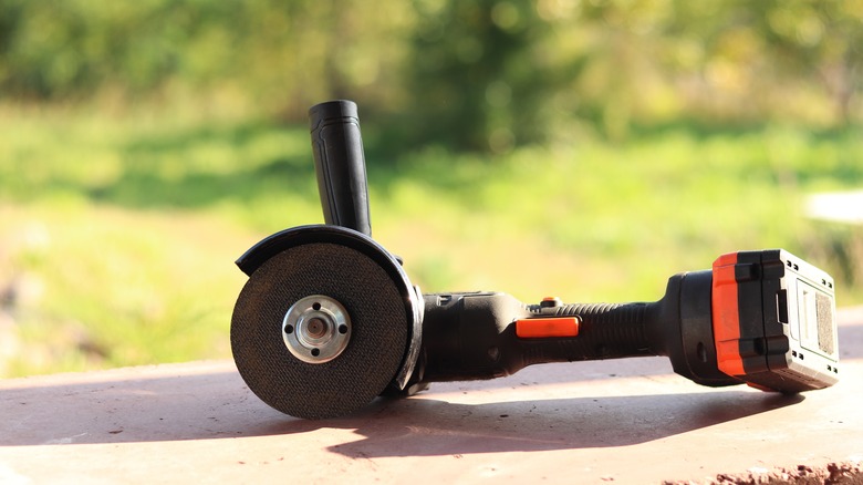 A handheld angle grinder tool