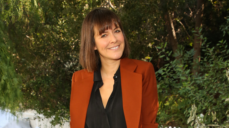 Leanne Ford in an orange blazer.