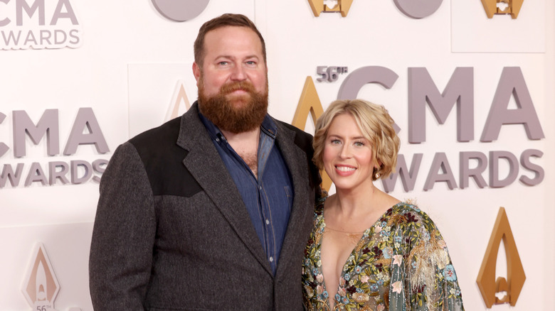 Ben and Erin Napier smiling on the red carpet.