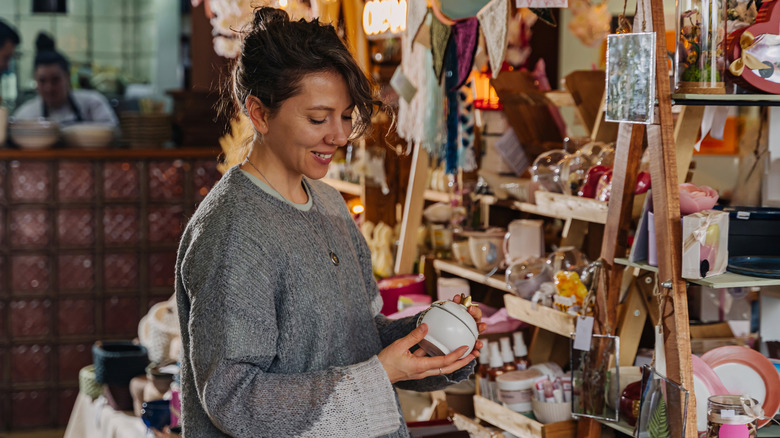 Woman shopping for handmade home decor.