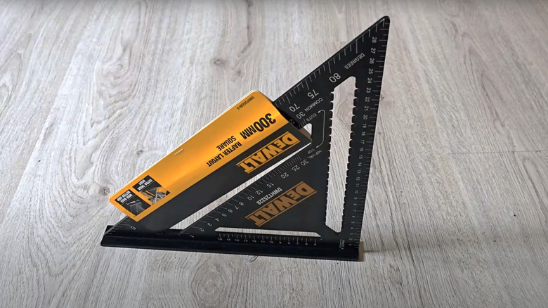 DeWalt framing speed square on light wood floor