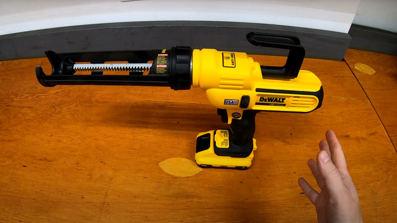 DeWalt Adhesive Gun on wooden table