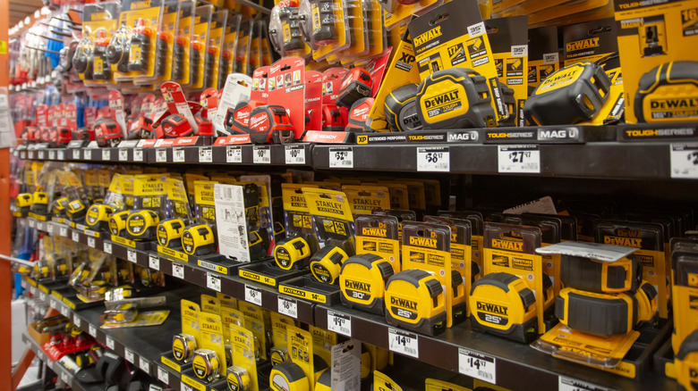 Expansive DeWalt tape measure selection on store shelf