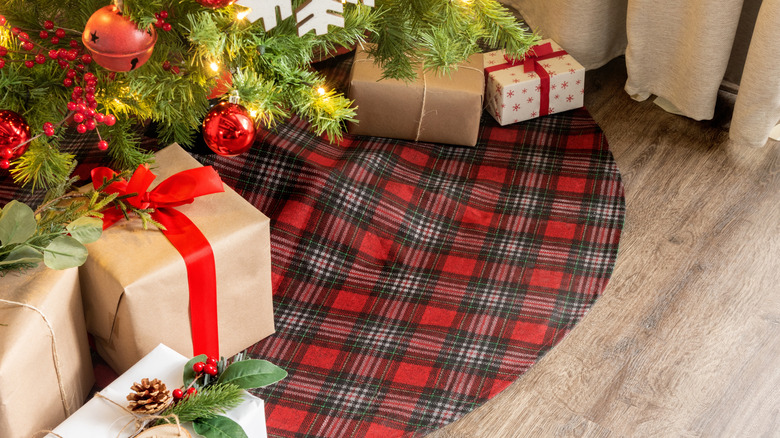 Plaid tree skirt under Christmas tree