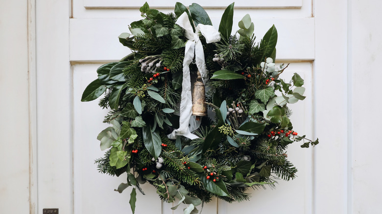 Lush green holiday wreath on front door