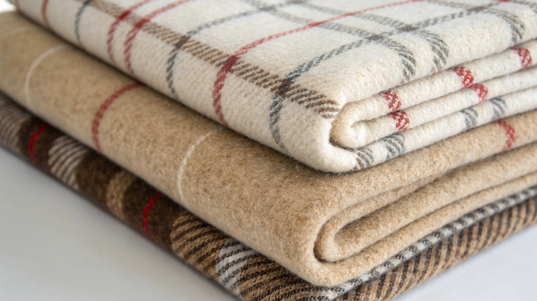 Stack of plaid wool blankets