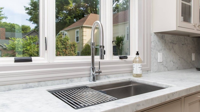 Kitchen sink in front of window