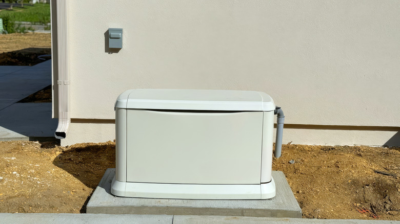 A backup generator installed outside a house.