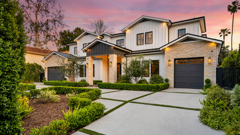 A landscaped yard in front of a house.