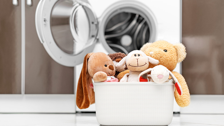 Children's toys in laundry basket