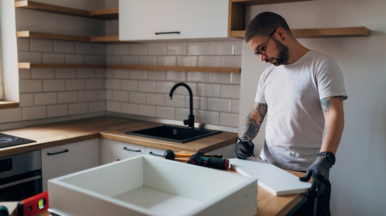 Man remodeling a kitchen