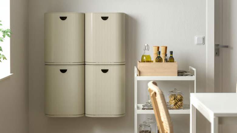Four Ikea hanging trash bins are shown in two rows of two on the wall