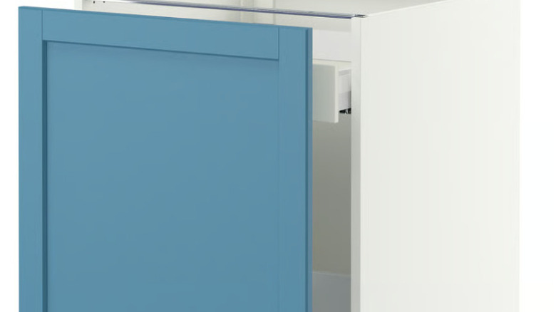 A blue Ikea base cabinet is shown with its recycle drawer partially pulled out