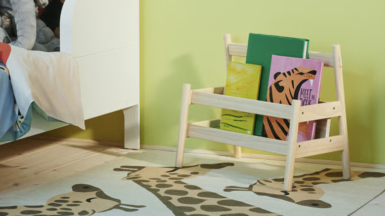An IKEA FLISAT book display shelf with a selection of books sitting in it