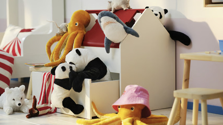 An IKEA VITBJÖRN storage unit with drawer, overflowing with soft toys