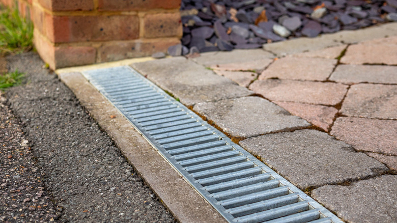 Linear channel drain next to pathway