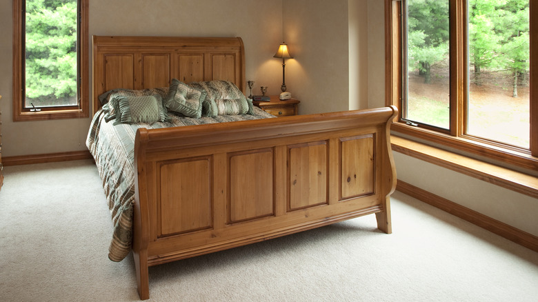 A bed with pine head and foot