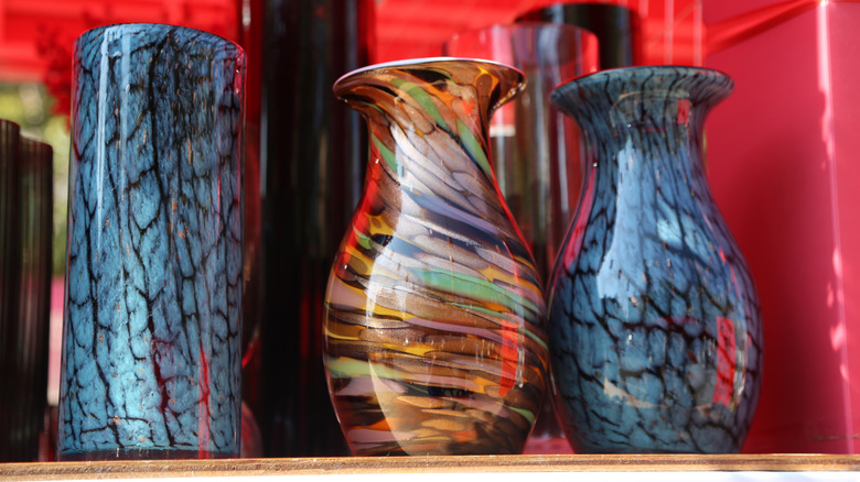 assorted glass vases on display on a shelf