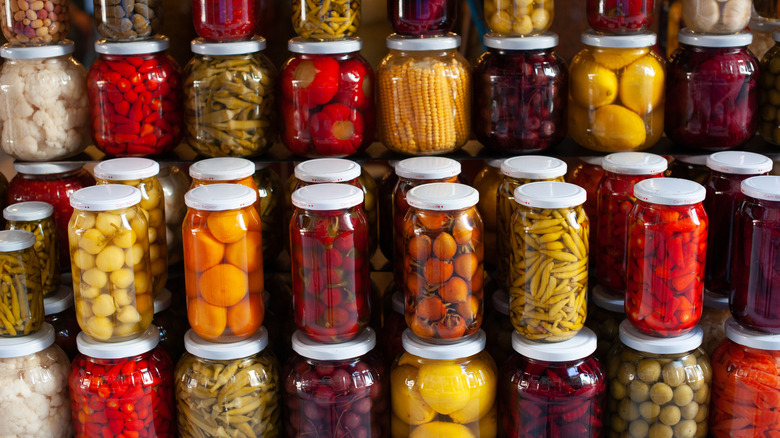 Preserved vegetables on display in neatly stacked rows