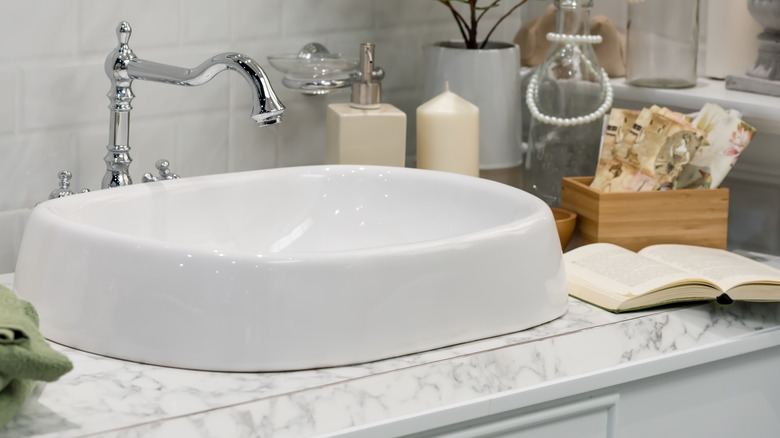 Open book on a bathroom countertop