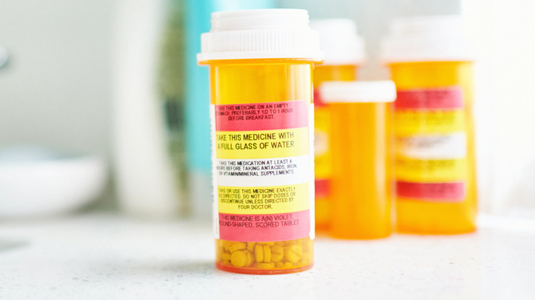 Pill bottles near bathroom sink