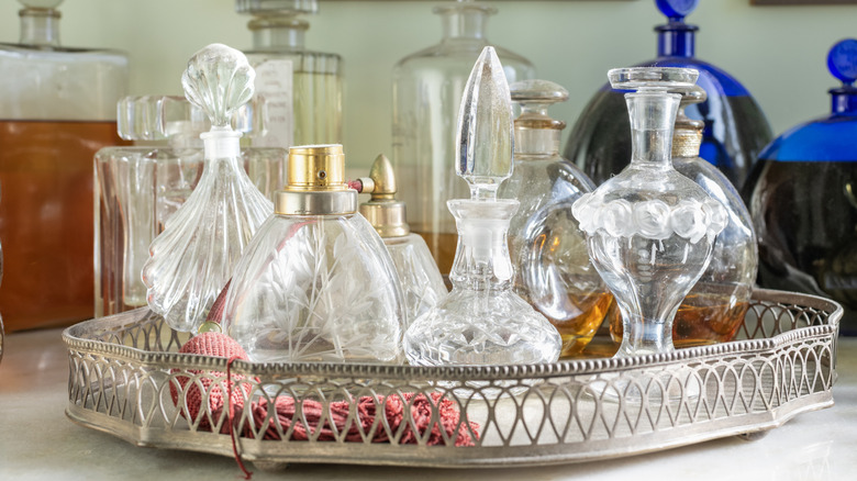 Fancy perfume bottles in a silver tray
