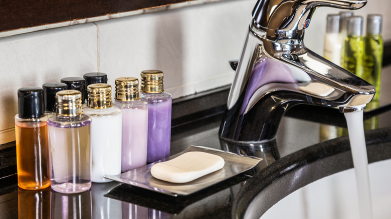 Colorful sample product bottles on a bathroom counter