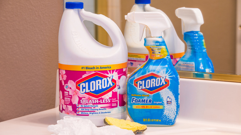 Clorox and Lysol bottles on a bathroom counter