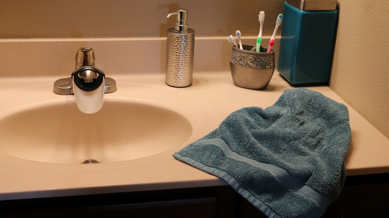 Used towel on a bathroom counter