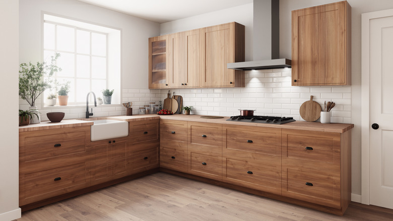 Medium brown kitchen cabinets in an open kitchen space