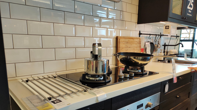 Kitchen essentials on a counter in an Ikea showroom