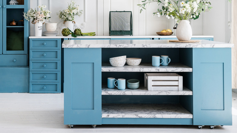 Blue kitchen island with open shelves