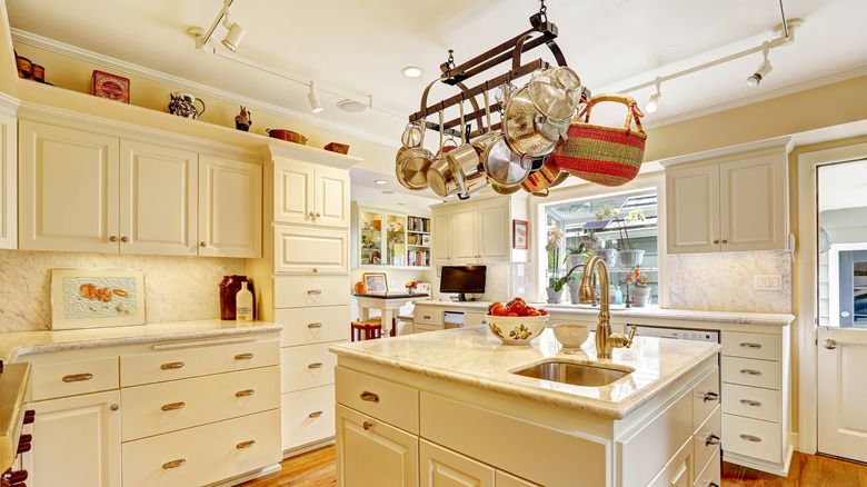 Pot rack hanging above kitchen island