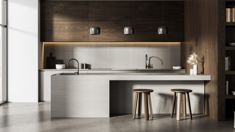 A contemporary kitchen with concrete floors.