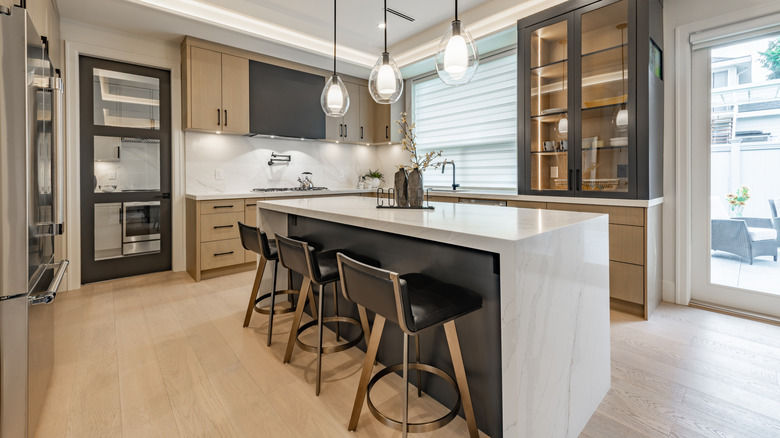 A modern kitchen with hardwood floors.