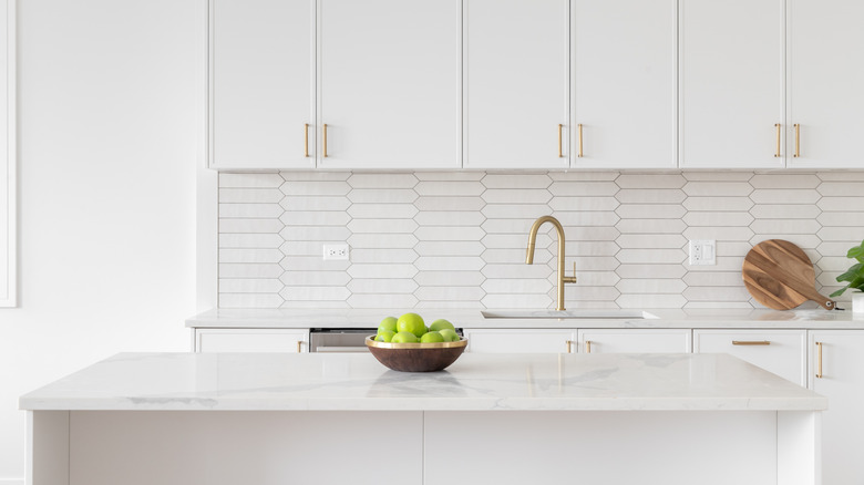 White kitchen with slight golden touches