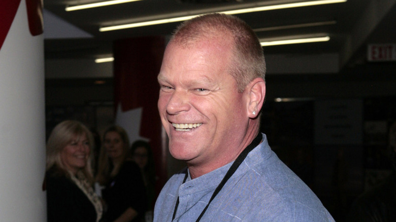 Mike Holmes smiling and wearing a blue shirt
