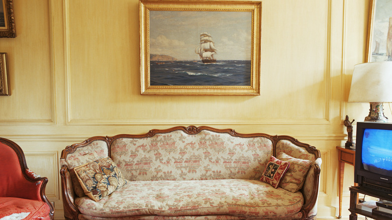 A vintage living room with light yellow walls.