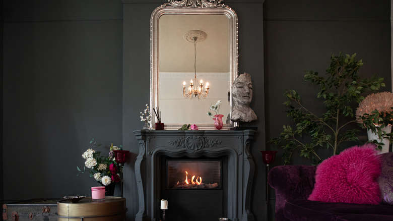 A dark gray living room with French details.