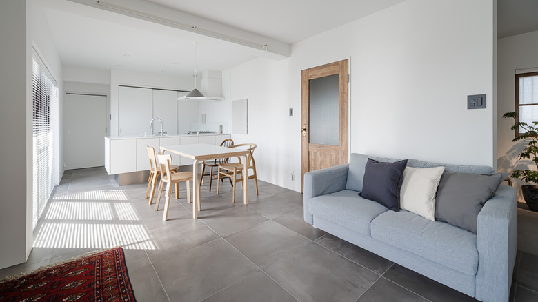 A white modern living and dining area.