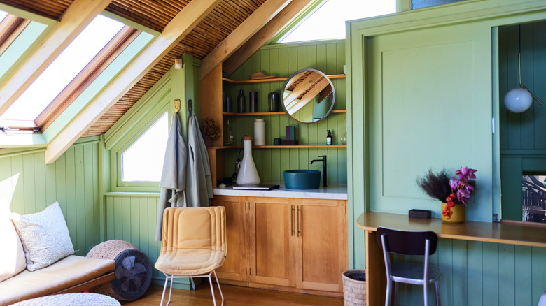 A rustic wood living space with light green walls.