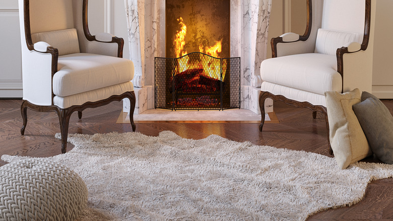 Living room with ornate marble fireplace