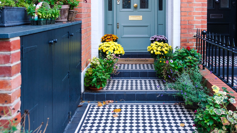 Victorian porch with black and white checkered tiles