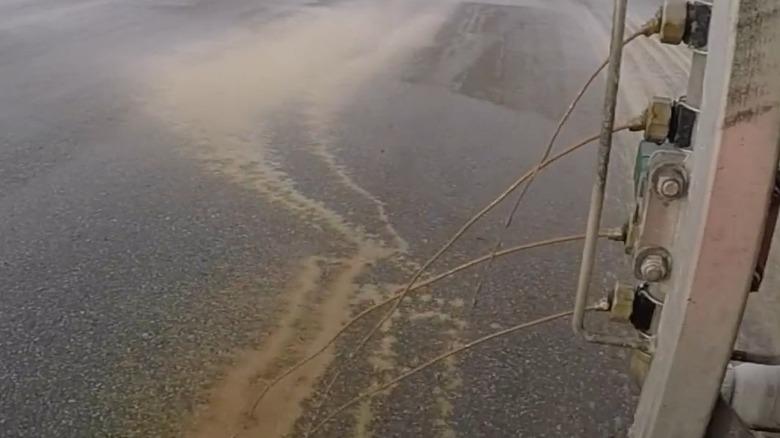 City truck spraying beet juice on roads